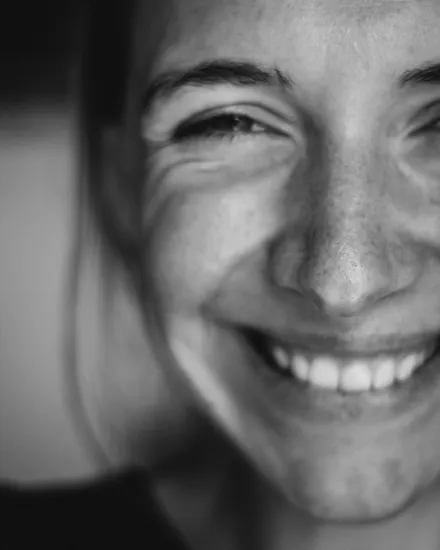 Caregiver smiling, evoking warmth and trust