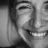 Caregiver smiling, evoking warmth and trust