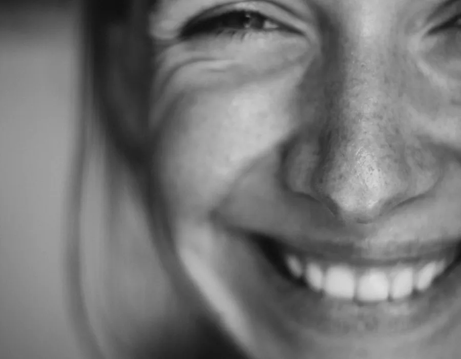 Caregiver smiling, evoking warmth and trust
