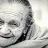Senior smiling toward the camera in a candid portrait